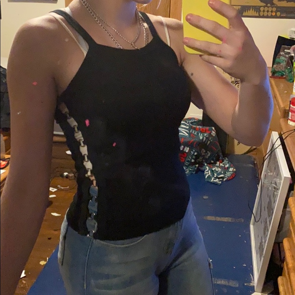 Black tank with silver rings lining sides